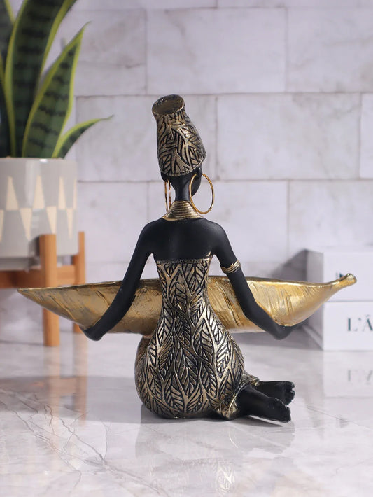 Black and gold African figurine jewelry holder